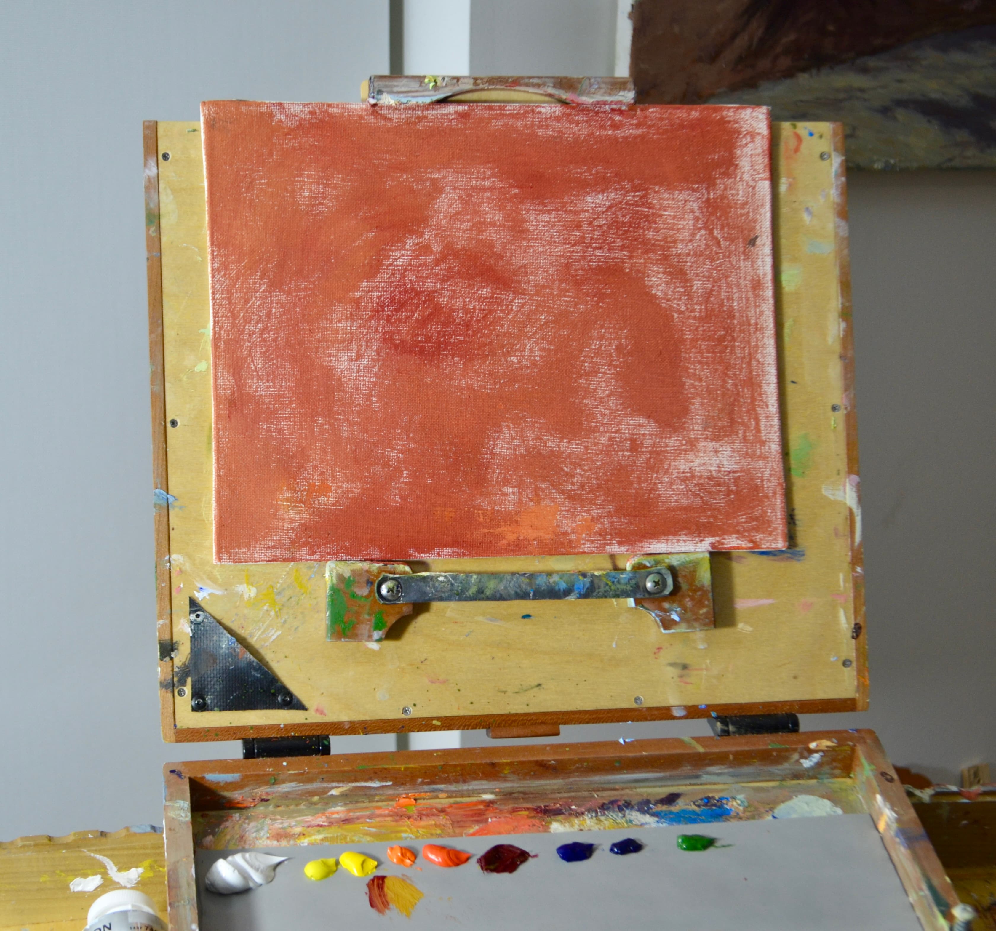 I started this painting with a bright red undercoat